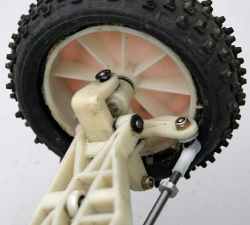 1991 Detroit Worlds RC10 - Front Left Steering Block Carrier Wheel Tire